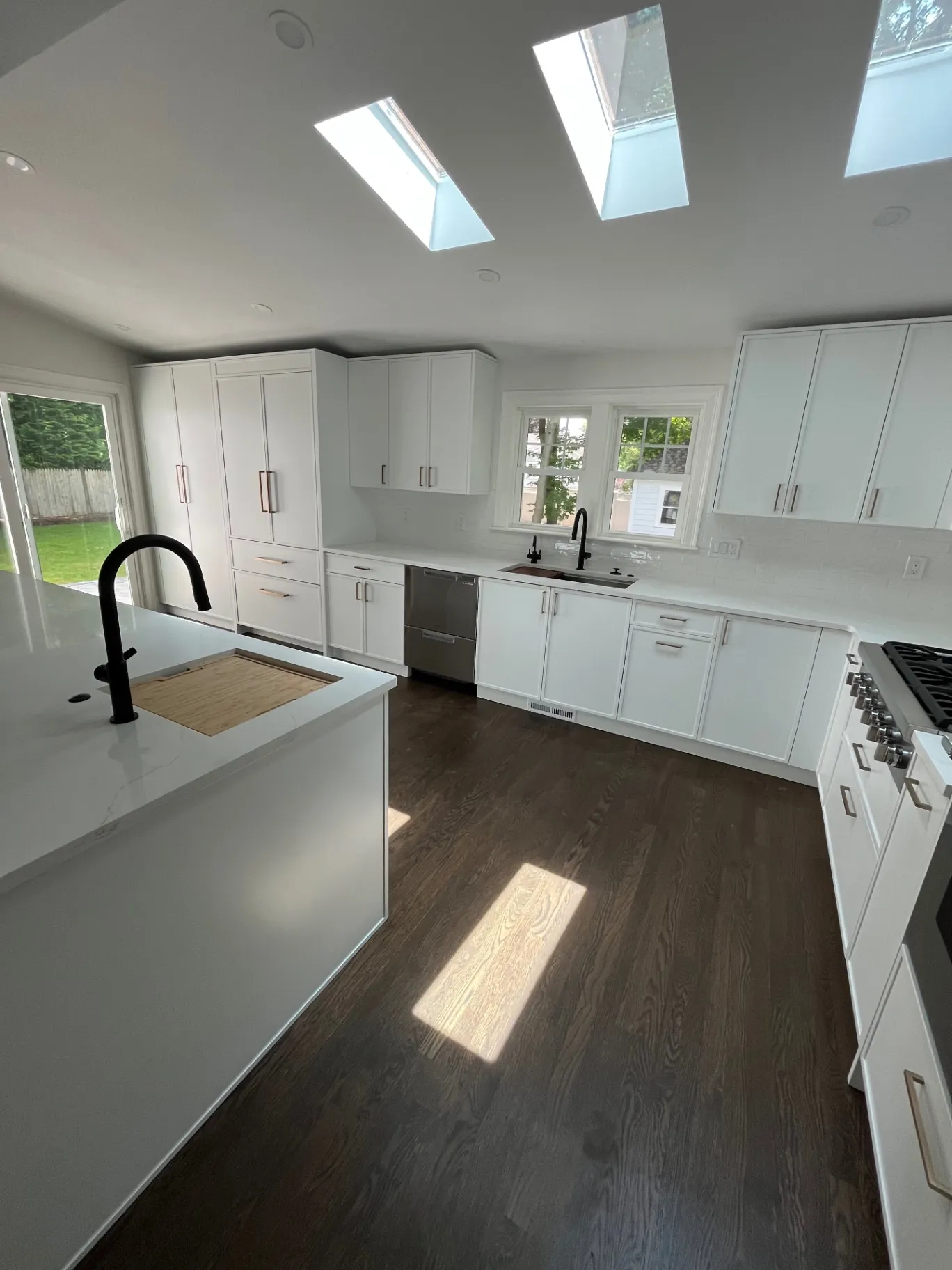 Freshly painted white kitchen cabinets in a Greater Boston home